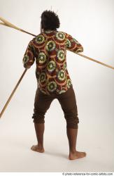 Man Adult Average Black Fighting with spear Standing poses Coat